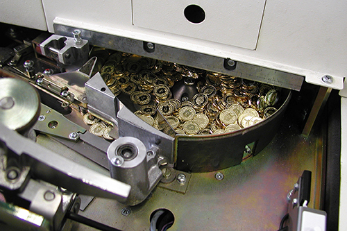 Coup d'œil dans une machine à emballer les monnaies